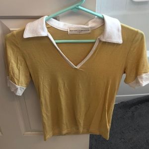 yellow collared shirt